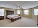 Spacious main bedroom with a ceiling fan and multiple windows at 11308 Callaway Pond Dr, Riverview, FL 33579