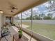 This screened patio has a beautiful view of the spacious backyard and sky at 11308 Callaway Pond Dr, Riverview, FL 33579