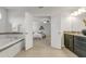 Open ensuite bathroom with double doors leading to the primary bedroom at 12017 Grand Kempston Dr, Gibsonton, FL 33534