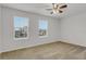 Bright, spacious bedroom with large windows offering natural light and neighborhood views at 12017 Grand Kempston Dr, Gibsonton, FL 33534