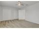 Spacious bedroom with double closets, a ceiling fan, and neutral carpeting at 12017 Grand Kempston Dr, Gibsonton, FL 33534