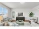 Spacious living room with hardwood floors, a large window, and comfortable seating, perfect for relaxing and entertaining at 12017 Grand Kempston Dr, Gibsonton, FL 33534
