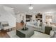 Open-concept living area seamlessly connects to kitchen, featuring modern furnishings and ample natural light at 12017 Grand Kempston Dr, Gibsonton, FL 33534