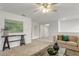 Loft area with neutral carpet, natural lighting, and a comfortable seating area at 12017 Grand Kempston Dr, Gibsonton, FL 33534
