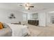 Cozy main bedroom with carpet, ceiling fan, and a modern dresser at 12017 Grand Kempston Dr, Gibsonton, FL 33534