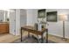 An in home office with stylish decor and easy access to a full bathroom and walk-in closet at 12017 Grand Kempston Dr, Gibsonton, FL 33534