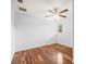 Well-lit bedroom with hardwood floors and ceiling fan at 13556 Lake Magdalene Dr, Tampa, FL 33613