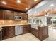Well-appointed kitchen with wood ceiling, stainless steel appliances, granite countertops, and tile backsplash at 13556 Lake Magdalene Dr, Tampa, FL 33613