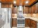 Modern kitchen boasts stainless steel appliances, custom cabinetry, and stylish backsplash at 13556 Lake Magdalene Dr, Tampa, FL 33613