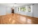 Inviting living room with large window and hardwood floors at 13556 Lake Magdalene Dr, Tampa, FL 33613