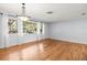 Open living room with natural light and hardwood floors at 13556 Lake Magdalene Dr, Tampa, FL 33613