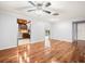 Spacious living room featuring hardwood floors, neutral walls, and an open floor plan at 13556 Lake Magdalene Dr, Tampa, FL 33613