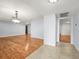 Spacious living room with hardwood floors, neutral paint, and ample natural light at 13556 Lake Magdalene Dr, Tampa, FL 33613