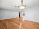 Open living room featuring hardwood flooring, neutral wall paint, and recessed lighting at 13556 Lake Magdalene Dr, Tampa, FL 33613