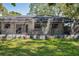 View of screened patio from grassy backyard at 14013 Briardale Ln, Tampa, FL 33618