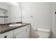 Clean bathroom with a single vanity and tiled shower at 14013 Briardale Ln, Tampa, FL 33618