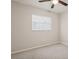 This bedroom features neutral walls, carpet, and a ceiling fan at 14013 Briardale Ln, Tampa, FL 33618