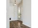 Inviting entryway featuring wood-look floors, a pendant light, and neutral wall paint at 14013 Briardale Ln, Tampa, FL 33618
