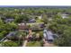 Scenic neighborhood aerial view with tree-lined streets and green lawns in this charming community at 1536 Alamo Ln, Dunedin, FL 34698
