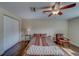 Spacious bedroom offers ceiling fan, wood floors, and closet at 1536 Alamo Ln, Dunedin, FL 34698