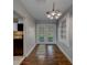 Hallway with dark wood floors, and view of the backyard at 1536 Alamo Ln, Dunedin, FL 34698