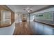Open-concept living area showcasing new wood floors, updated neutral paint, and natural light at 1536 Alamo Ln, Dunedin, FL 34698
