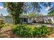 Home exterior, including the screened in patio and lush landscaping at 1821 20Th N Ave, St Petersburg, FL 33713