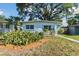 The house with beautifully landscaped front yard featuring lush greenery at 1821 20Th N Ave, St Petersburg, FL 33713