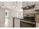 Modern kitchen featuring stainless steel appliances, white cabinetry, and stylish subway tile backsplash at 1821 20Th N Ave, St Petersburg, FL 33713