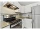 The kitchen has sleek stainless steel appliances, subway tile backsplash, and granite counters at 1821 20Th N Ave, St Petersburg, FL 33713