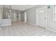 The open floor plan features tile floors and lots of natural light from windows and a glass front door at 1821 20Th N Ave, St Petersburg, FL 33713