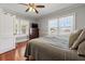 Comfortable bedroom with hardwood floors, natural light, and neutral tones at 1842 Nebraska Ne Ave, St Petersburg, FL 33703