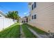 Driveway to garage with lush lawn, offering ample parking and a well-maintained exterior at 1842 Nebraska Ne Ave, St Petersburg, FL 33703