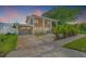Charming home with a welcoming front porch, featuring a well-maintained exterior and inviting curb appeal at 1842 Nebraska Ne Ave, St Petersburg, FL 33703