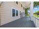 Wide view of the front porch area showcasing windows and a red front door at 1842 Nebraska Ne Ave, St Petersburg, FL 33703