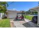 View of detached two-car garage and golf cart from the backyard at 1842 Nebraska Ne Ave, St Petersburg, FL 33703