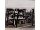 Vintage photograph of a two-story home featuring mature trees, circa 1949 at 1842 Nebraska Ne Ave, St Petersburg, FL 33703