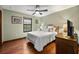 Cozy bedroom with hardwood floors, a ceiling fan, and natural light from window at 1916 38Th W St, Bradenton, FL 34205