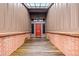 Inviting home entrance with a brick-lined walkway leading to a striking red front door at 1916 38Th W St, Bradenton, FL 34205