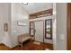 Welcoming foyer with hardwood floors, a decorative bench, and natural light through sidelight windows at 1916 38Th W St, Bradenton, FL 34205