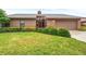 Charming single-story home with beautiful landscaping and a well-manicured green lawn at 1916 38Th W St, Bradenton, FL 34205