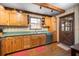 Charming eat-in kitchen with vintage cabinets, solid surface countertops, and updated appliances at 1916 38Th W St, Bradenton, FL 34205