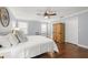 Bright main bedroom with hardwood floors, ceiling fan, closet, and natural light from windows at 1916 38Th W St, Bradenton, FL 34205