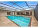 Spacious enclosed pool with an outdoor entertaining area and sun-soaked deck at 1916 38Th W St, Bradenton, FL 34205