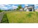 The expansive fenced backyard showcases a lush green lawn with ample space for outdoor activities and recreation at 19592 Breynia Dr, Lutz, FL 33558