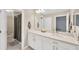 Bathroom featuring double sinks and neutral-toned vanity, blending style with functionality at 19592 Breynia Dr, Lutz, FL 33558