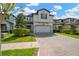 Beautiful two-story home featuring manicured landscaping and a brick paved driveway leading to a two car garage at 19592 Breynia Dr, Lutz, FL 33558