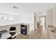 Hallway and office space, filled with sunlight, offers practicality with a scenic view at 19592 Breynia Dr, Lutz, FL 33558