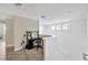 Light-filled hallway with desk, offers a view of other living spaces, with a calming neutral palette at 19592 Breynia Dr, Lutz, FL 33558