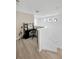 Bright hallway with desk and neutral paint, perfect for a study nook near the stairs at 19592 Breynia Dr, Lutz, FL 33558